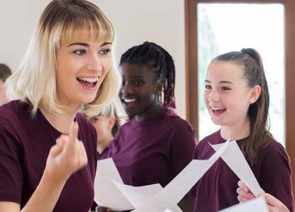 school children having singing lessons