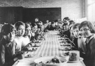 school photo from Gosford Hill School, Kidlington, 1930s showing girls sitting at a dining table